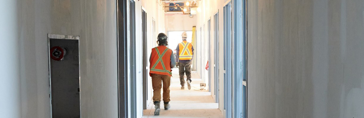 Photo of interior of MSF building men walking down hallway